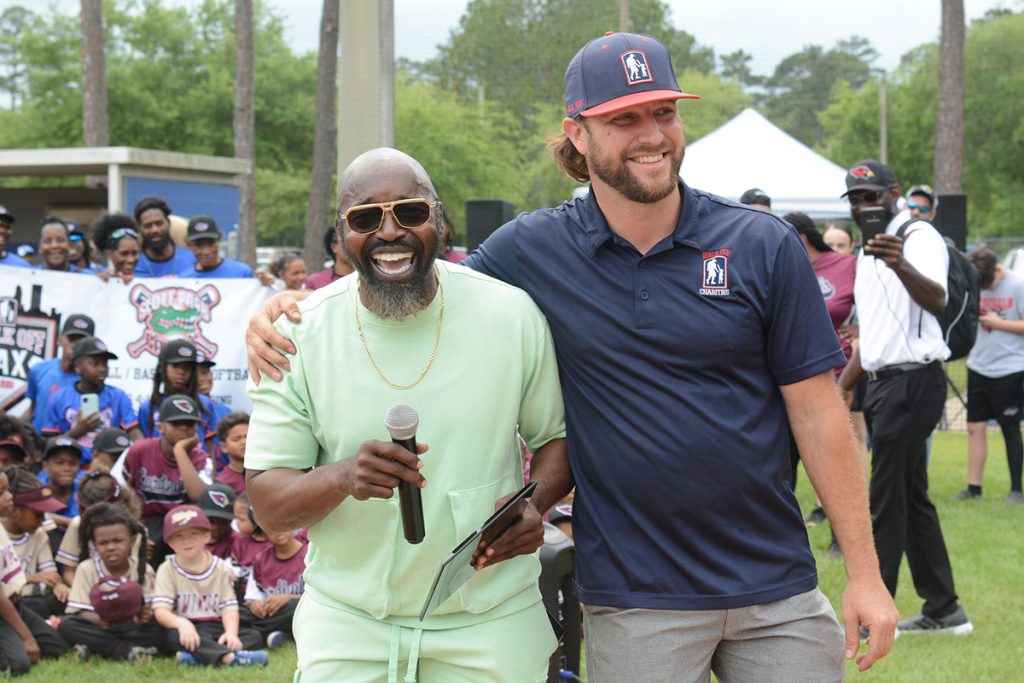 Coach Wesley and Walk Off Charities Executive Director Jarrod Simmons shared a laugh during the Walk Off Charities Spring Baseball Celebration Weekend introductions.