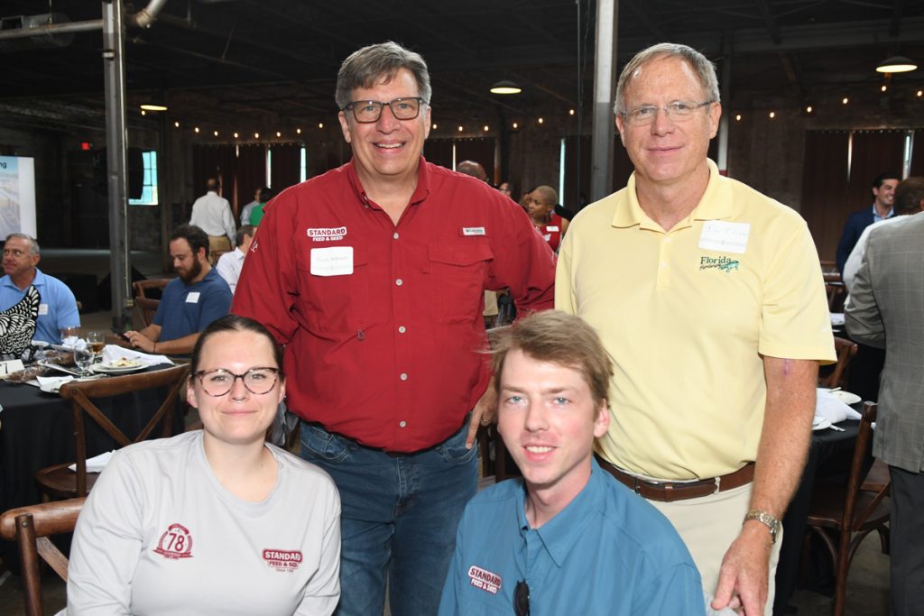 Standard Feed & Seed’s Ashley Pass, Frank Wallmeyer and Geoffrey Williams with Florida Hardware’s Don Thieman