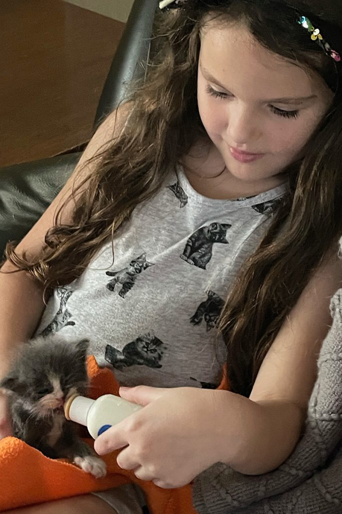 Sarah Earley bottle feeds Harry