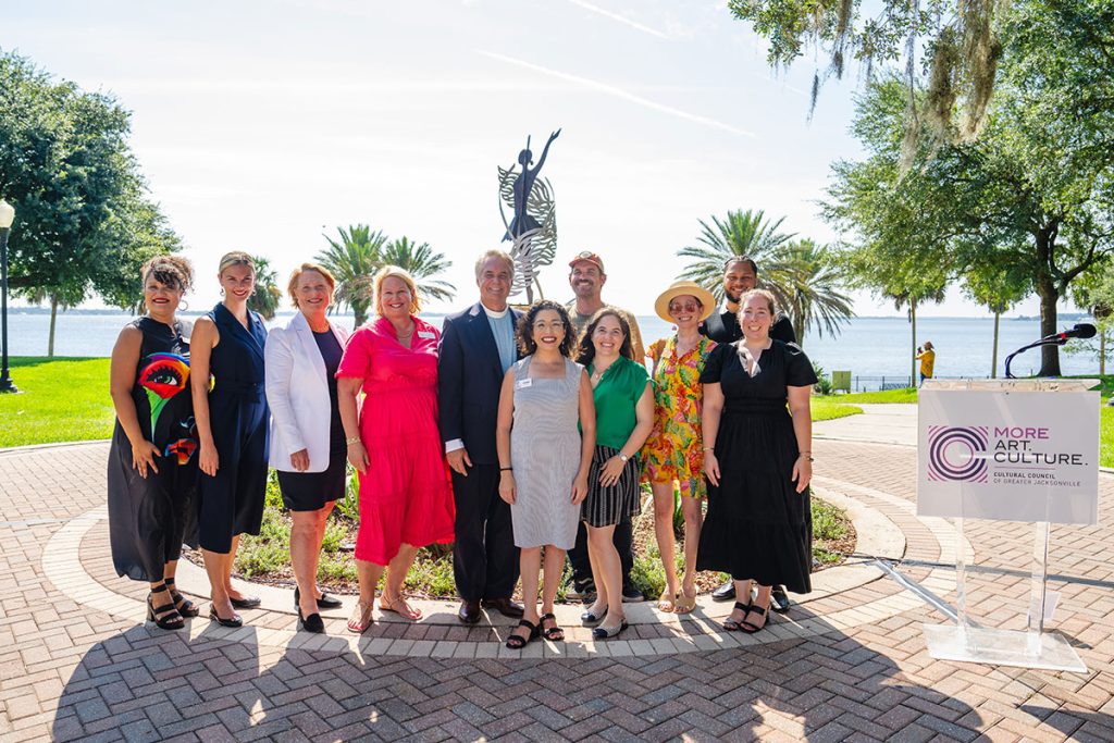 Cultural Council officials and community leaders join with Drew Haramis and sculptor David Main to dedicate "On Allison's Wings" at Stockton Park.