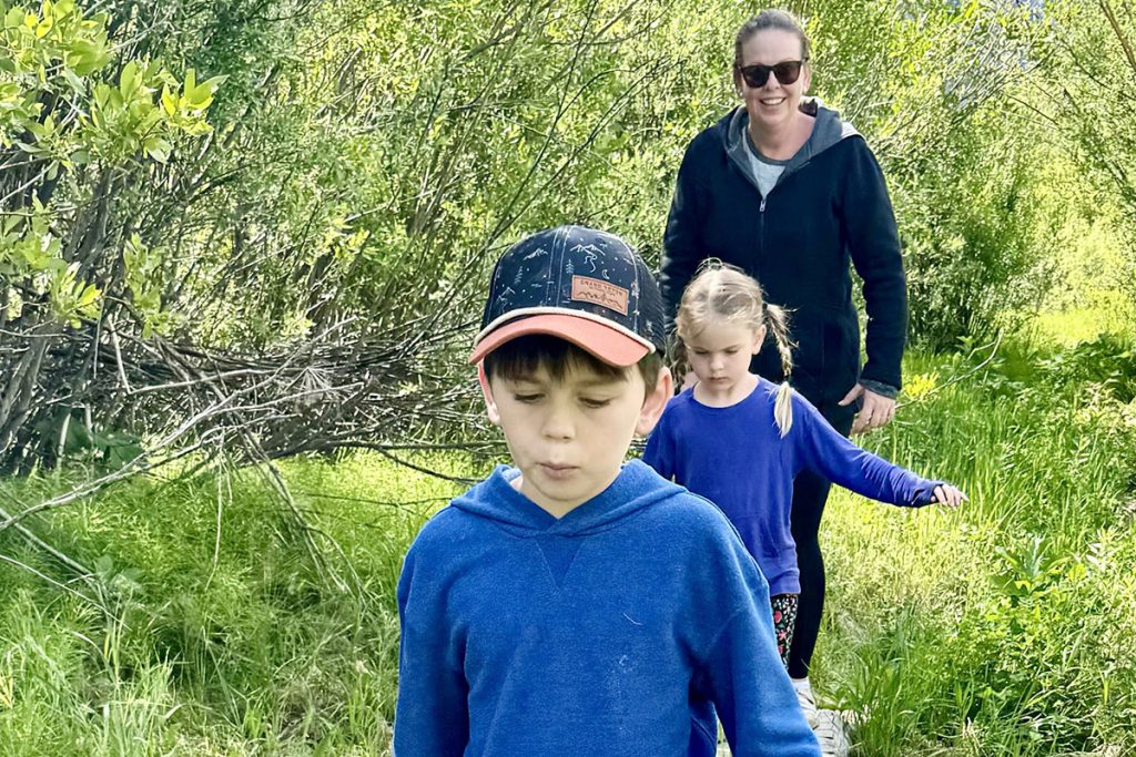 Natalie Wells hiking in Yellowstone with her kids, 
Grady Wells and Anne Marie Wells
